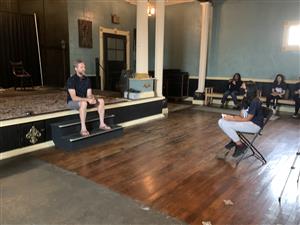 Christian Gray sitting inside the 40th Street Theater